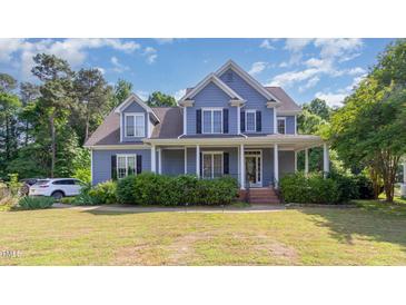 Charming two-story home featuring a welcoming front porch and well-maintained landscaping at 4516 Ocean Crest Cir, Raleigh, NC 27603