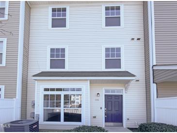 Traditional two-story townhome featuring a charming entrance and symmetrical window design at 350 Gilman Ln # 104, Raleigh, NC 27610