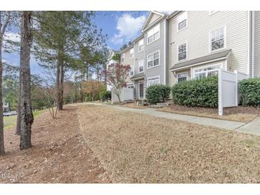 Charming townhomes with well-maintained landscaping and inviting entrances at 1311 Canyon Rock Ct # 105, Raleigh, NC 27610