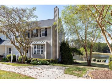 Charming townhome with well-manicured lawn and lake views at 200 Nottinghill Walk, Apex, NC 27502