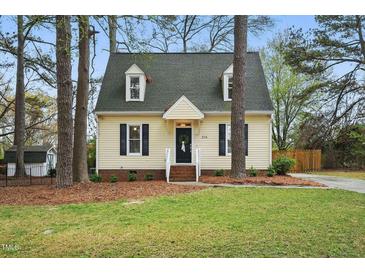 Charming two-story home with a well-maintained lawn and inviting front entrance at 204 Arnold Ln, Fuquay Varina, NC 27526