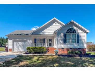 Charming single-story home with a well-maintained front yard and a covered porch at 2105 Antioch Church Rd, Timberlake, NC 27583