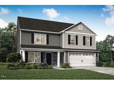 Charming two-story home featuring a gray exterior, black shutters, and a two-car garage at 290 Shiloh Way, Mebane, NC 27302
