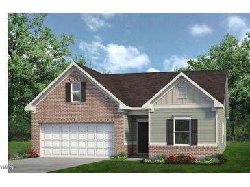 Charming single-Gathering home with a brick and siding exterior, complemented by a well-manicured lawn at 34 E American Marigold Dr # 64, Benson, NC 27504