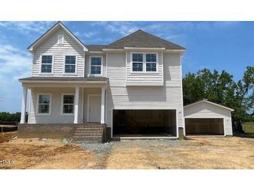 New two-story home with an attached two car garage and detached single car garage at 39 Atherton Circle, Angier, NC 27501