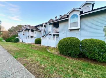 Charming condos feature manicured lawns, complemented by lush shrubbery and white picket fences at 4907 Hollenden Dr # 105, Raleigh, NC 27616