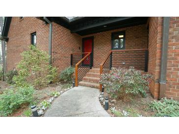 Charming front entry with well-maintained landscaping and an appealing walkway at 917 Queensferry Rd, Cary, NC 27511