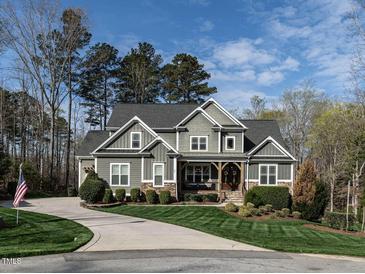 Beautiful two-story home featuring a well-manicured front yard and a curved driveway at 107 Bella Casa Way, Clayton, NC 27527