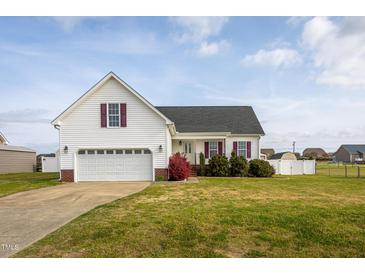 Charming single-Gathering home with a two-car garage, well-maintained lawn, and inviting curb appeal at 114 Hudson Dr, Princeton, NC 27569