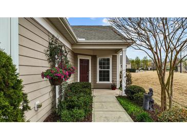 Inviting home entrance with flower baskets and well-maintained landscaping at 1404 Palmer Hill Dr, Durham, NC 27703