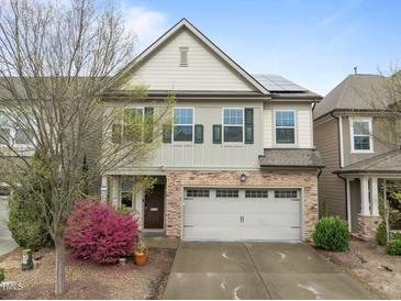 Charming two-story home with stone accents, a two-car garage, and a well-manicured front yard at 219 Begen St, Morrisville, NC 27560