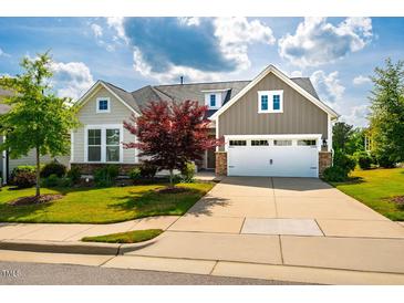 Charming home featuring a two-car garage, manicured lawn, and appealing curb appeal in a well-maintained neighborhood at 237 Abercorn Cir, Chapel Hill, NC 27516
