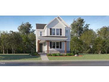 Charming two-story home with front porch and well-maintained landscaping in a desirable neighborhood at 316 Canyon Spring Trl, Wake Forest, NC 27587