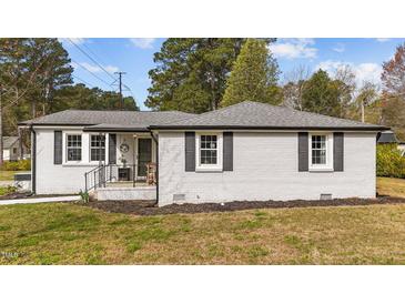 Charming single story home featuring freshly painted exterior, black shutters, and inviting front porch at 116 Lakewood Dr, Wendell, NC 27591