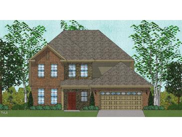Two-story home featuring a brick and stone facade, complemented by a two-car garage and a neatly maintained lawn at 2719 Lacy Holt Rd, Graham, NC 27253