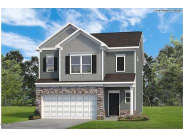 Charming two-story home with a stone-accented garage, gray siding, and black shutters surrounded by a beautiful green lawn at 200 Bruce Drive Dr, Dunn, NC 28334