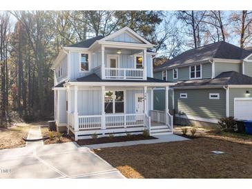 Charming two-story home with a welcoming front porch and upper level balcony at 306 Cecil St, Durham, NC 27707