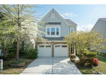 Charming two-story home featuring a stone and siding exterior with a two-car garage at 3011 September Dr, Durham, NC 27703
