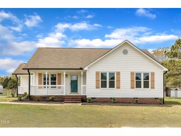 Charming single-story home with a welcoming front porch and well-maintained lawn at 3533 N Way Dr, Zebulon, NC 27597