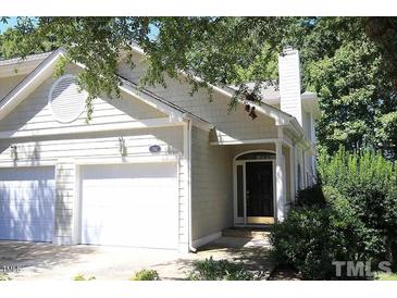 Charming home featuring an attached two-car garage and inviting front entrance at 212 Columbia W Pl, Chapel Hill, NC 27516