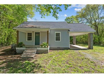 Charming single-story home with a covered carport and a cozy front porch at 5864 Whitney Rd, Graham, NC 27253