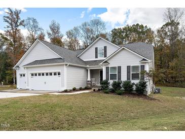Charming single-Gathering home with a two-car garage and well-maintained lawn at 121 Viajar Way, Smithfield, NC 27577