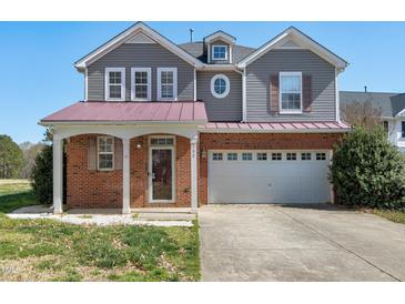 Charming two-story home with a two-car garage and a cozy front porch at 192 Solheim Ln, Raleigh, NC 27603