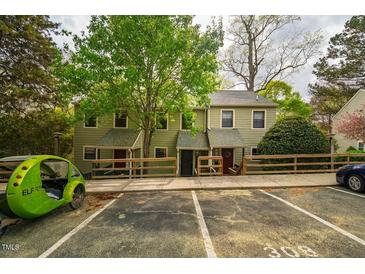 Charming townhomes featuring cozy front porches and convenient parking at 308 Cedarwood Ln, Carrboro, NC 27510