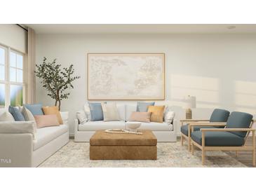 Bright living room featuring neutral furniture, modern art, and a decorative tree for a cozy atmosphere at 456 Barnes Landing Dr # 39, Four Oaks, NC 27524