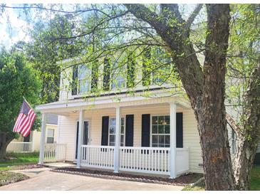 Charming two-story home featuring a cozy front porch and a well-maintained front yard at 4616 Silverdene St, Raleigh, NC 27616