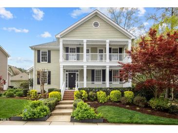 Charming two-story home with a welcoming front porch and well-manicured landscaping at 30079 Britt, Chapel Hill, NC 27514