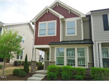 Charming two-story home with inviting curb appeal and colorful siding at 1725 Mallard Trace Dr, Wendell, NC 27591