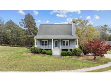 Charming single-Gathering home with a cozy front porch and landscaped front yard at 4810 Mitchell Mill Rd, Wake Forest, NC 27587