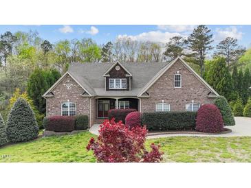 Charming brick home with manicured landscaping and a welcoming front entrance at 5317 Serather Ct, Garner, NC 27529