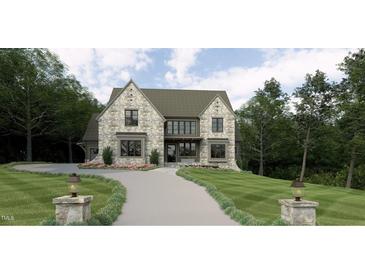 Beautiful stone home with a long driveway and lush landscaping at 7641 Falls Creek Ln, Raleigh, NC 27614