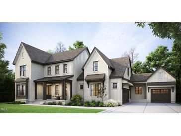Charming two-story home boasts a brick and siding facade, complemented by a manicured lawn and inviting front porch at 1644 Legacy Ridge Ln, Wake Forest, NC 27587