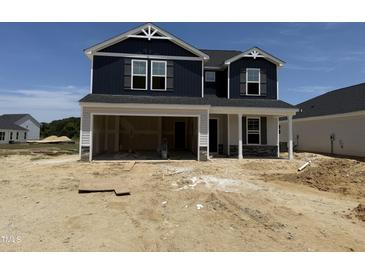 Two-story home featuring navy siding and a two-car garage in a new residential community at 18 W Emily Gardens Dr, Selma, NC 27577