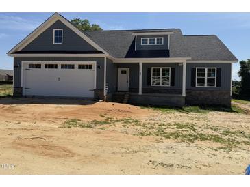 Charming craftsman-style home with a two-car garage and stone accents, offering modern curb appeal at 40 Bailey-Boykin Rd, Selma, NC 27576