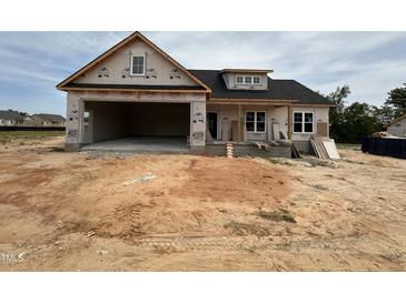 New home under construction with a two-car garage and covered porch at 40 Bailey-Boykin Rd, Selma, NC 27576