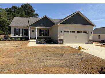 Charming single-Gathering home featuring a two-car garage and craftsman-style architectural details at 47 Royal Ave, Selma, NC 27576