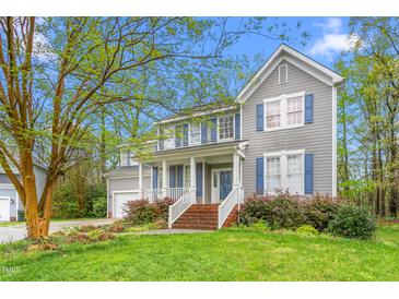 Charming two-story home featuring a cozy front porch and a well-manicured lawn at 101 Elk River Ct. Ct, Mebane, NC 27302