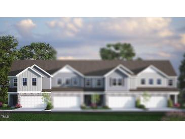 Attractive townhouse showcasing neutral siding, a gray roof, and a two-car garage, offering modern curb appeal at 2314 Sugar Cone Way, Fuquay Varina, NC 27526