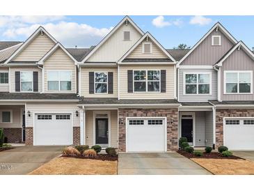 Charming townhomes with stone accents, attached garages and inviting curb appeal at 5 Galway Glenn Ln, Durham, NC 27705