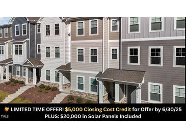 View of townhome exteriors, showcasing a blend of colors and architectural details at 5432 Crescent Square St, Raleigh, NC 27616