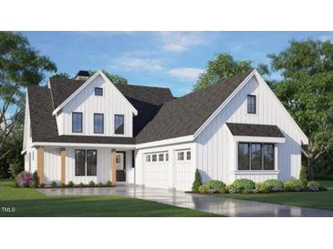 Charming two-story home featuring white siding, a dark roof, manicured landscaping, and an attached two-car garage at 1029 Azalea Garden Cir, Raleigh, NC 27603