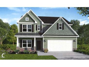 Charming two-story home with a two car garage and a landscaped yard at 25 Malbec Way, Youngsville, NC 27596