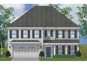 Charming two-story home featuring a combination of brick and siding, enhanced by black shutters and a well-manicured lawn at 75 Black Walnut Dr # 189, Garner, NC 27529