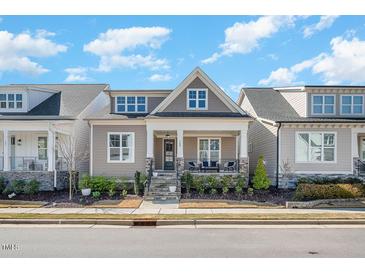 Charming home featuring a cozy front porch and stone accents, set in a welcoming neighborhood at 149 Logbridge Rd, Chapel Hill, NC 27516