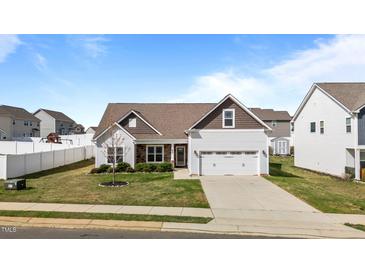 Charming single-Gathering home with a two-car garage, well-maintained lawn, and inviting curb appeal at 205 Mcclellan Trl, Mebane, NC 27302
