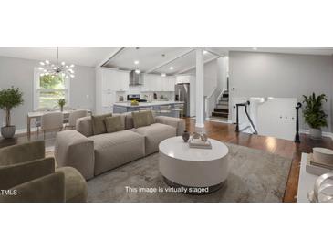 Bright, airy living room showcasing an open concept, neutral tones, and ample space at 2120 Hillock Dr, Raleigh, NC 27612